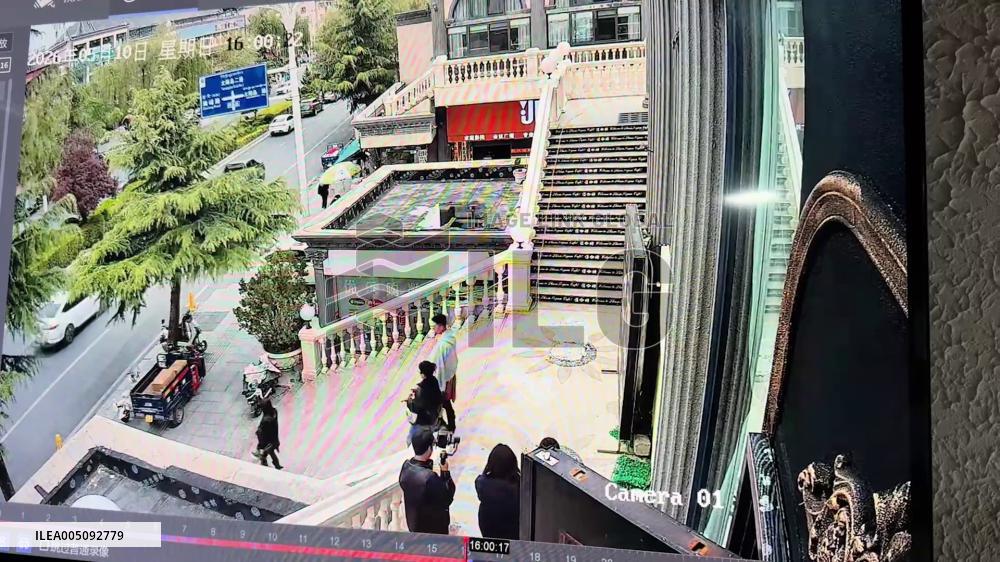 China: Woman Crushed by Falling Sign While Walking Down Stairs
