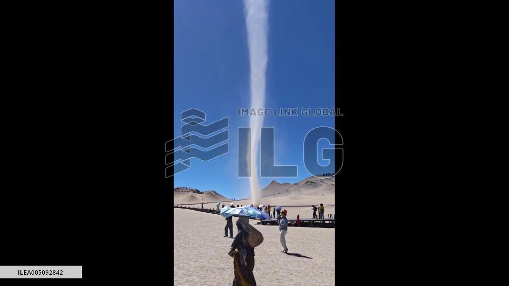 China: Towering Dust Devil Sweeps Through Qinghai Desert Scenic Area