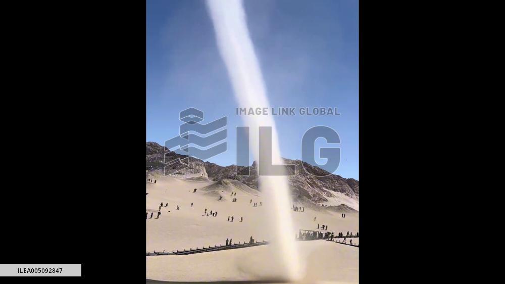 China: Towering Dust Devil Sweeps Through Qinghai Desert Scenic Area 2