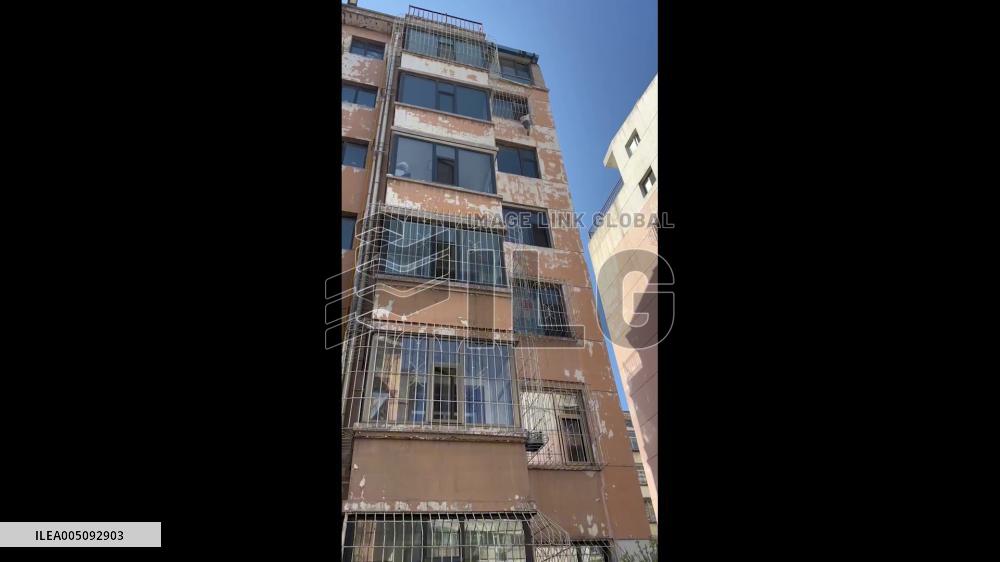 China: Men Rescue Child Dangling From Sixth Floor Window Grille