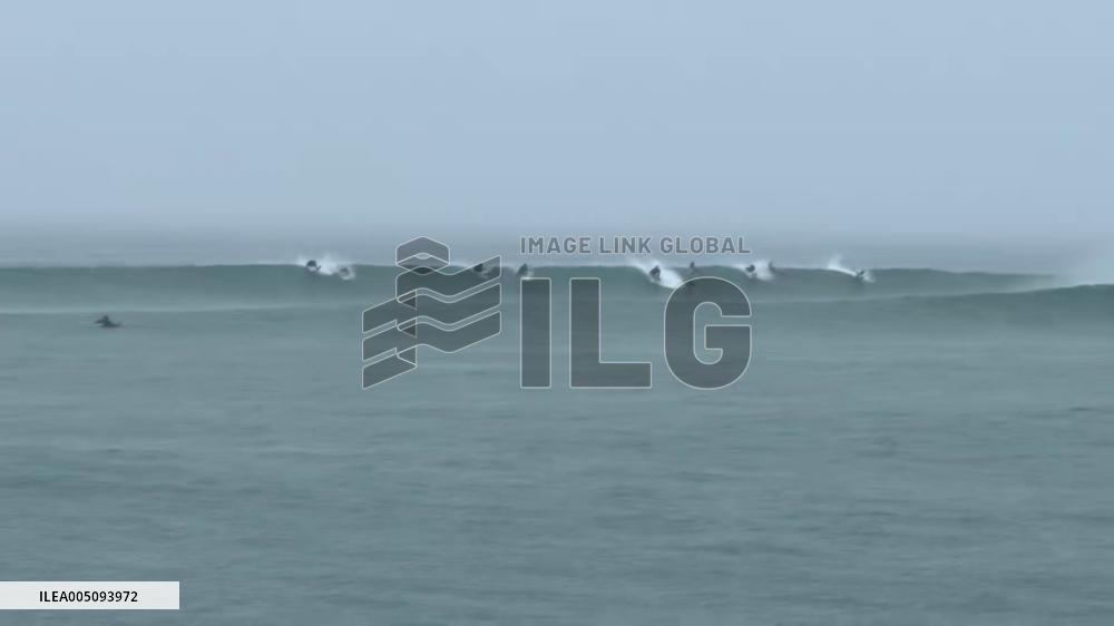 Japan: Surfers Ride Waves Along Coast as Typhoon Dujuan Approaches