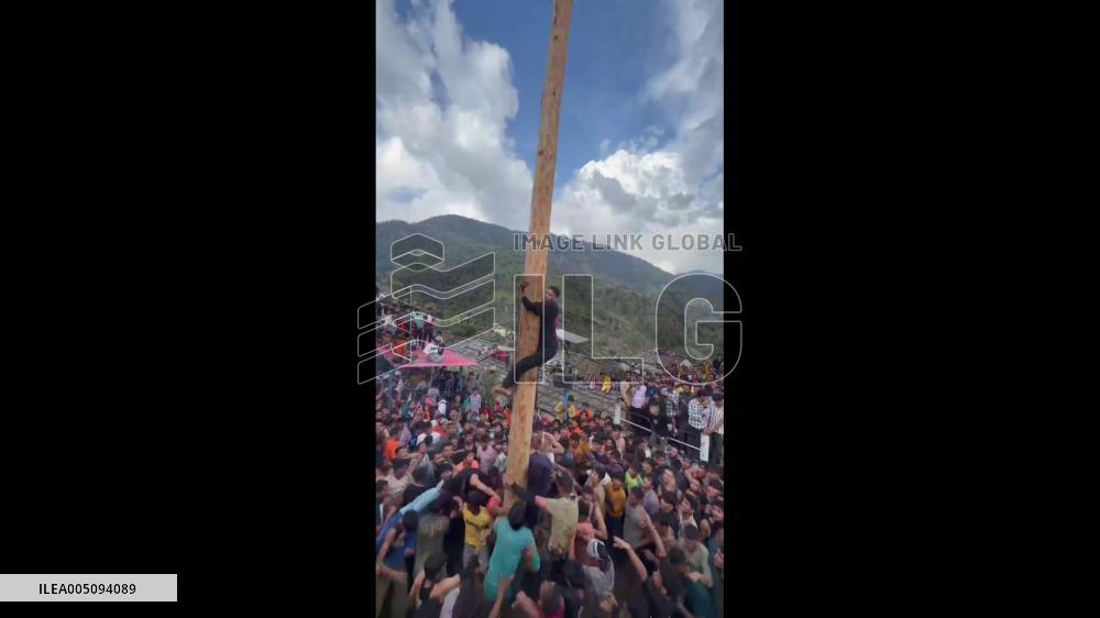 India: Traditional Tree-Climbing Contest Held During Nanda Pati Mela