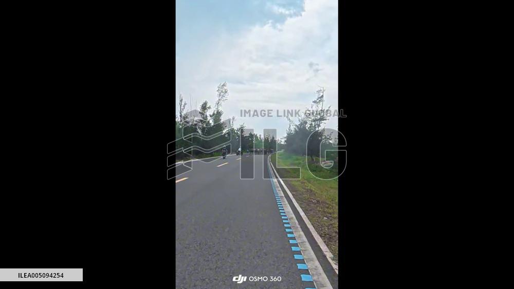 China: Motorcyclists Flee as Water Buffalo Herd Charges Toward Them